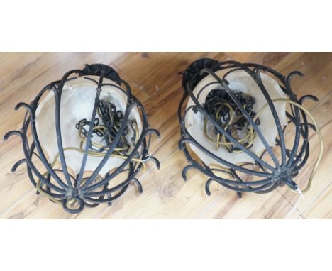 Two hanging iron lantern lights