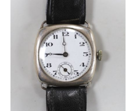A gentleman's 1920's silver manual wind wrist watch, with Arabic dial and subsidiary seconds, on a later leather strap.