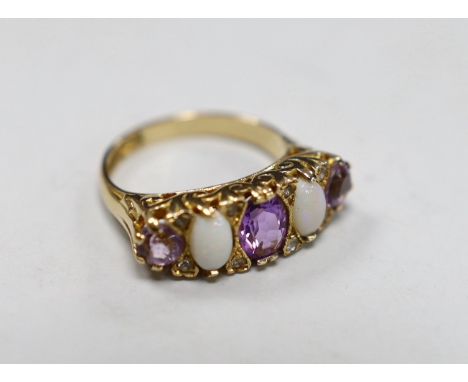 A modern 9ct gold, three stone amethyst and two stone white opal set half hoop ring, with white stone chip spacers, size L/M,