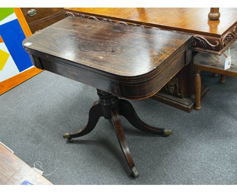 A Regency inlaid rosewood D shaped folding card table, width 86cm, depth 44cm, height 74cm