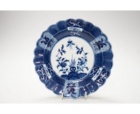 An 18th century Caughley plate painted with Scholars Rock, C mark, verso, 18cm.