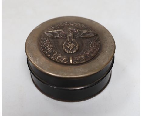 A composition and metal snuff box, with Third Reich insignia. 7cm diameter