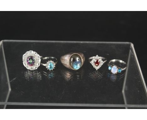 Five silver stone set rings including topaz, opal, garnet, apatite and labradorite, all with certificates