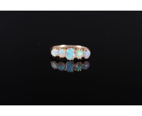 An 18ct gold opal set five stone ring (two opals are as found), size L 1/2, approx 2g