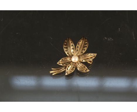 A 9ct gold floral brooch set with single pearl, approx 5g
