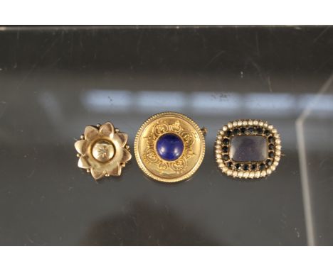 Three yellow metal brooches including lapis, target brooch, pearl mourning brooch etc