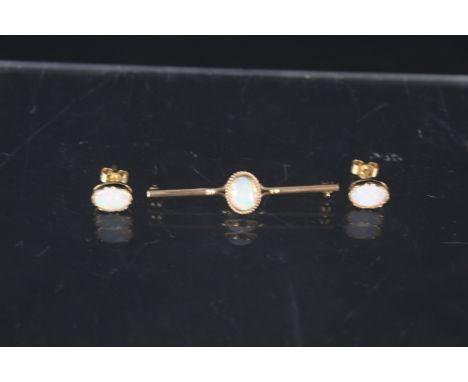 A 9ct gold opal set bar brooch plus a pair of similar earrings, approx 3.5g