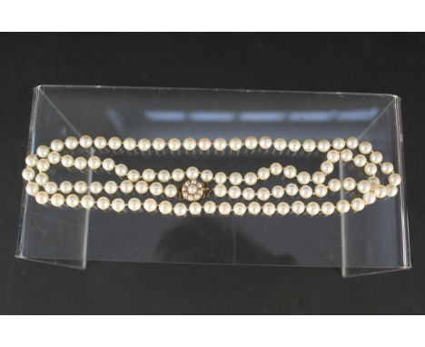 A cultured pearl necklace with 9ct gold pearl set clasp