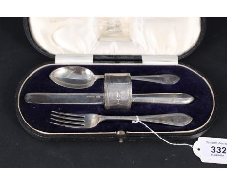 A boxed silver christening set including spoon, fork, knife and napkin ring, each item engraved with initials, hallmarked She