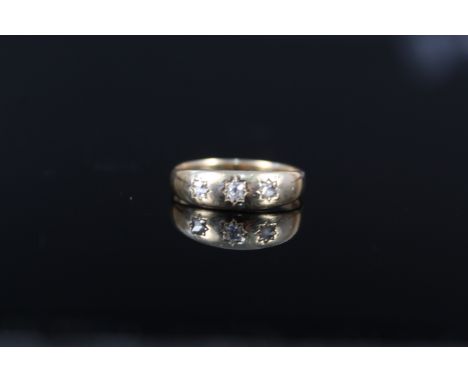 An 18ct gold three diamond ring, each diamond in star cut setting, size Q, approx 3.5g