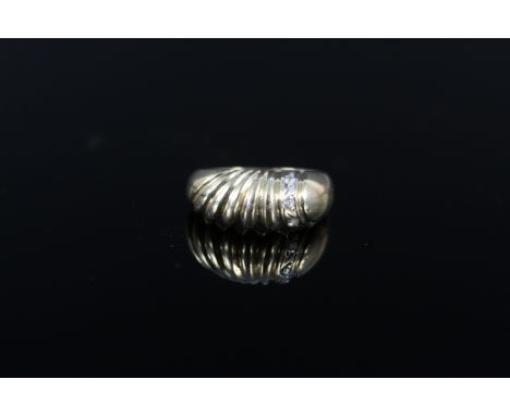 A 14ct gold ring set with three small diamonds, size M, approx 3g