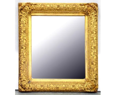 A VICTORIAN GILTWOOD AND COMPOSITION MIRROR 72CM X 63CM 