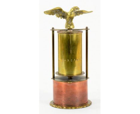 A BRASS PILLAR TIMEPIECE WITH CAST EAGLE FINIAL, 22CM H