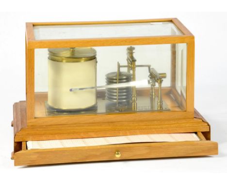 A SEWILLS LACQUERED BRASS BAROGRAPH WITH NICKEL DIAPHRAGM IN OAK CASE WITH BEVELLED GLASS LIGHT AND CHART DRAWER, 36CM W  