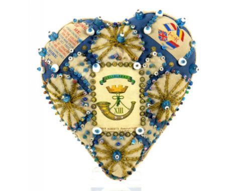 VICTORIAN SOLDIER'S CRAFTS. A VICTORIAN HEART SHAPED SILK AND COTTON PIN CUSHION DECORATED WITH SEQUINS AND COLOURED GLASS BE