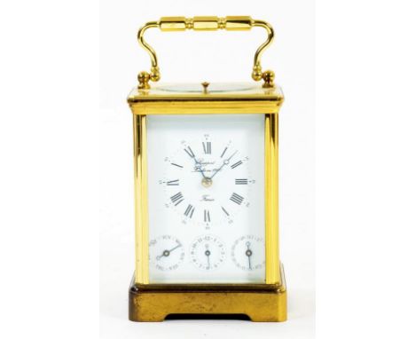 A FRENCH BRASS CARRIAGE CLOCK THE GONG STRIKING MOVEMENT WITH ALARM, DAY AND DATE, BY RAPPORT IN CORNICHE CASE WITH REPEAT BU