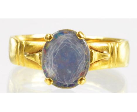 A 22CT GOLD WEDDING RING LATER SET WITH AN ASSOCIATED OPAL TABLET, 4.8G