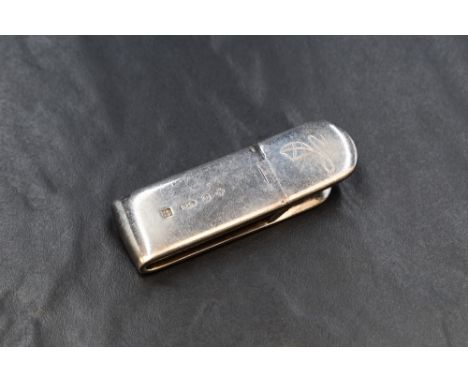 An Elizabeth II silver money clip of traditional form having a flying kite engraving marks for Birmingham 2000 maker L &amp; 