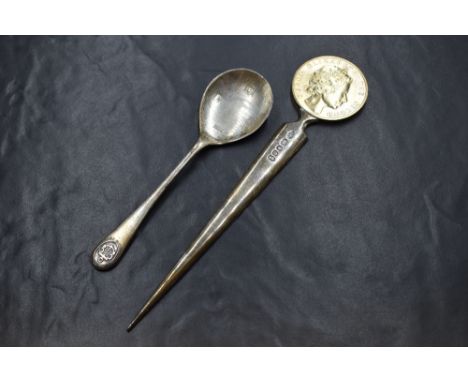 A cased Elizabeth II silver Silver Jubilee letter opener, the Silver Jubilee commemorative coin on a silver rounded blade, ma