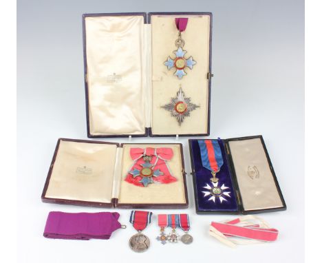 A K.B.E. enamelled neck badge and breast star with Garrard &amp; Co fitted case, a C.B.E.L. lady's breast badge with civil is