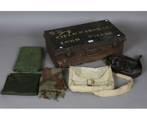 A collection of mid-20th century militaria, including a combat smock, dated '1965', and an R.E.M.E. enamelled car badge, a ca