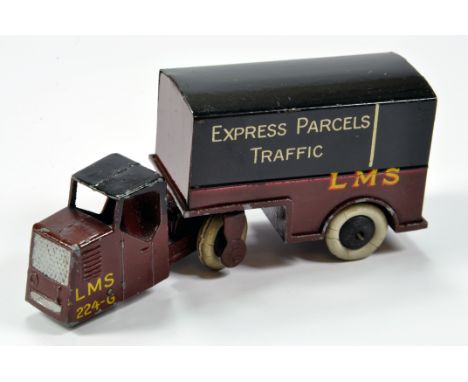 Dinky No.33r Pre-War Mechanical Horse and Railway Trailer  in LMS livery. Item is in maroon with black roof/upper body  Expre