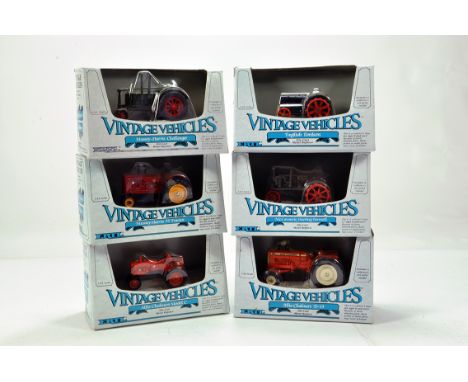 Assortment of Ertl 1/43 Vintage Farm Series Tractor models comprising Massey Harris, Allis Chalmers and others. NM in Boxes. 