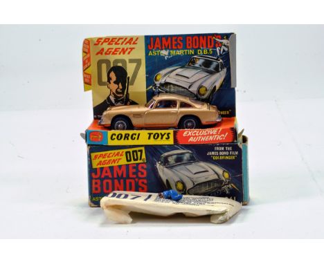 Corgi No. 261 James Bond Aston Martin DB5 Goldfinger issue with gold body, red interior, figures and secret instructions. Gen