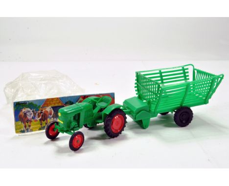 Hausser Elastolin Traktor (Tractor) Deutz D15 with Forage Trailer. Scarce issue is E with original header card and bag.Traile