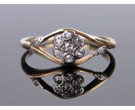 An 18ct gold diamond cluster ring,setting height 7mm, size K.