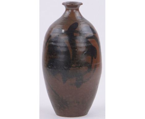A Studio Pottery bottle vase in the style of Bernard Leach,with brown glaze and foliate decoration, height 9".