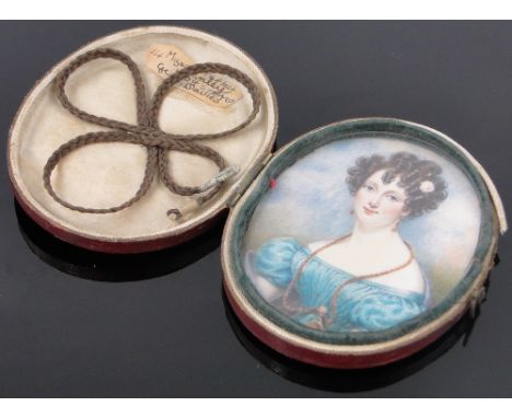 An early 19th century miniature watercolour portrait of Miss G Linley,in original hinged leather case, height 3.25".