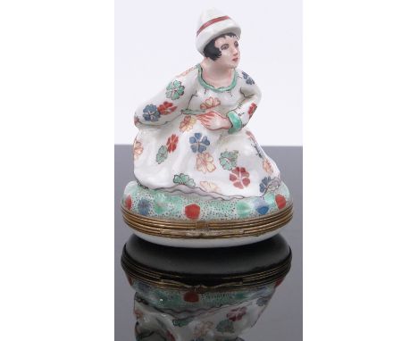Antique novelty porcelain box and cover,depicting a lady sitting on a commode, 3.25".