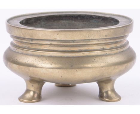 A Chinese bronze censor on 3 feet,having 4 character mark, diameter 6.25".