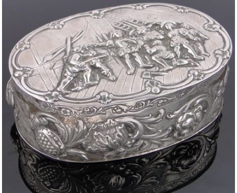 A continental oval silver box,the lid decorated with a relief sea battle scene, and relief decorated acanthus and floral surr