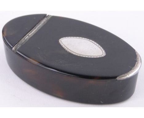 An oval tortoiseshell snuff box and cover,with white metal mounts, length 2.9".