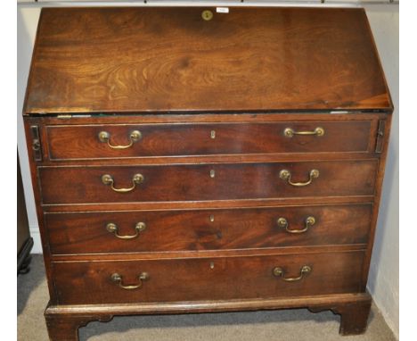 A Georgian mahogany bureau,with fitted interior, 4 long drawers under, bracket feet, width 3'6", height 3'8", depth 1'11".