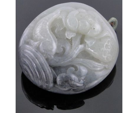 A carved jade pendant,with design of flowers and fish, height 2.5".