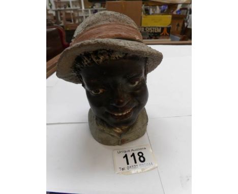 A vintage tobacco jar in the shape of a head