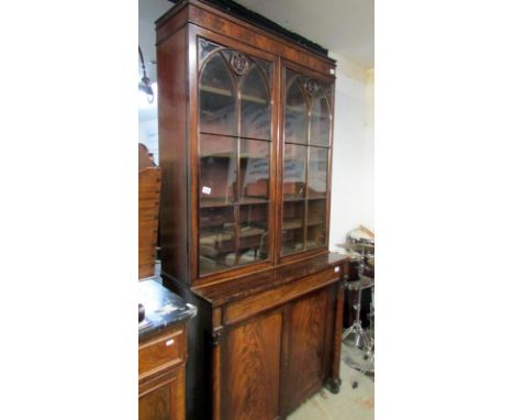 A Victorian mahogany Gothic style bookcase, (1 glass panel a/f)