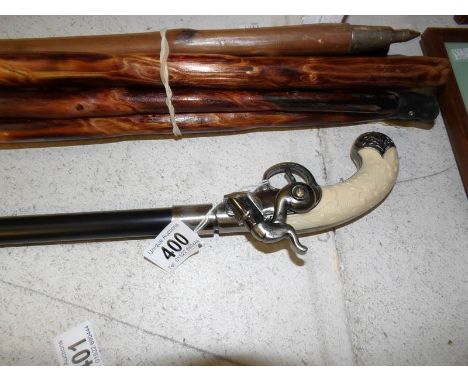 A walking stick with pistol handle