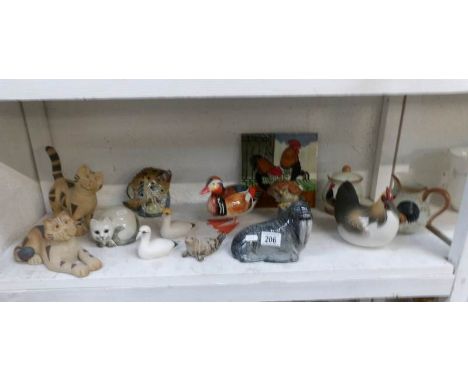 A shelf of mixed items including animal figures