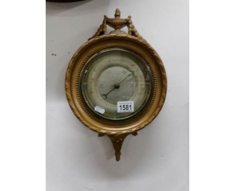 An ornate Regency style barometer