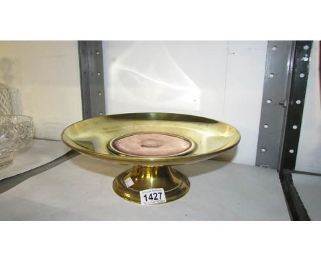 A large and heavy brass and copper arts and crafts tazza, the centre panel with engravings ob a bird and foliage