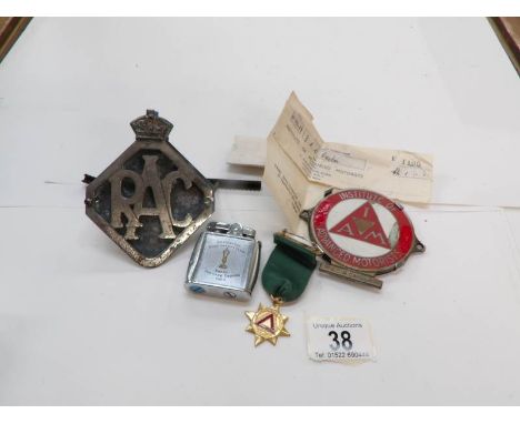 2 car badges and a Bachelor's road safety club lighter