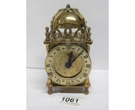 A brass lantern clock
