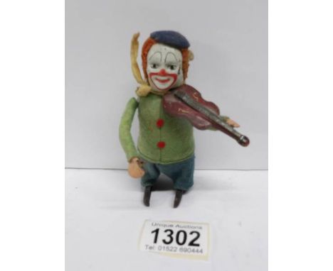 A pre-war Schuco clockwork clown violin player, missing bow and key but working