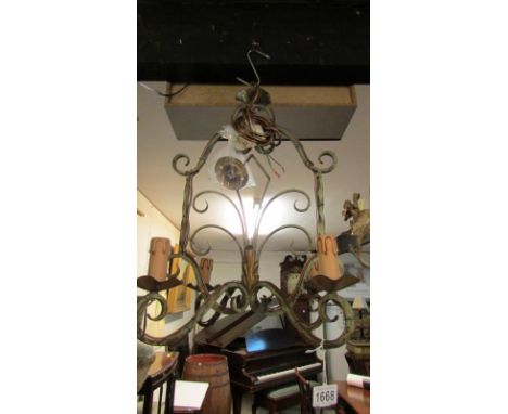 A wrought iron 4 lamp ceiling light