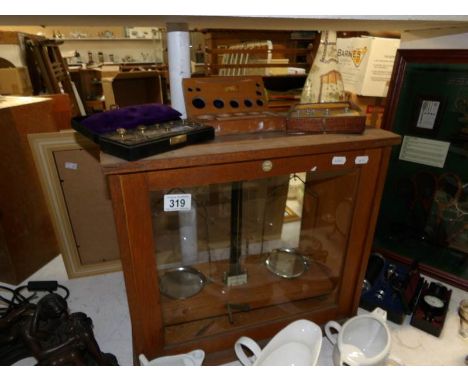 A cased set of apothecary scales together with cased weights