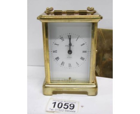 A brass Bayard carriage clock (back door needs fixing)